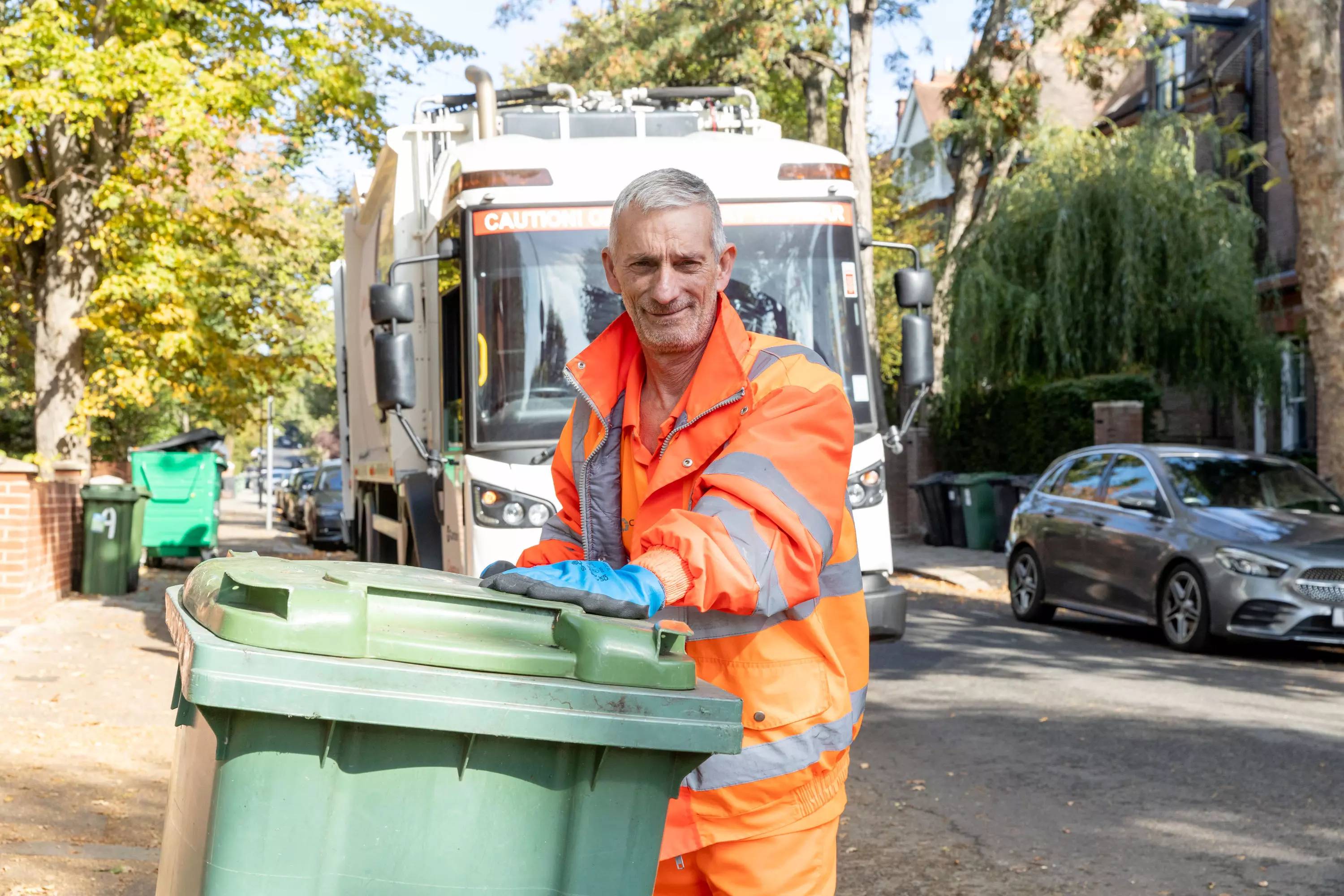 Veolia team member smiling while on a collection round